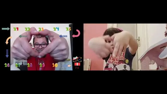 Danny Andreas on an early video call with his daughter, both framing their faces with their hands during a shared numbers activity