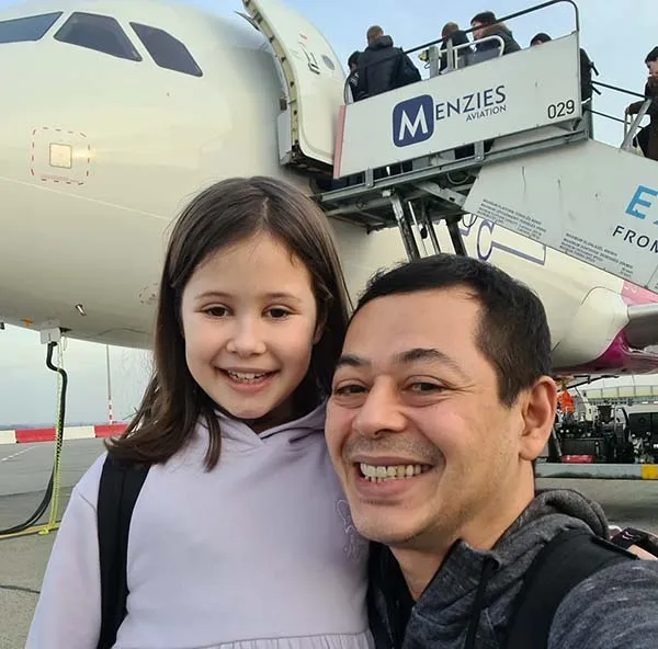 Danny Andreas and his daughter, photographed together at an airport